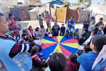 Children in Gaza receive support from UNRWA staff members. In his priorities speech the UN chief paid tribute to the agency as the backbone of the humanitarian response in Gaza.