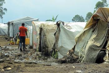 A man carries water in a camp for displaced people in Goma, in the eastern Democratic Republic of the Congo.