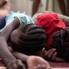 Children sleep in a school in Port-au-Prince, Haiti, where their families have taken refuge from gang violence.