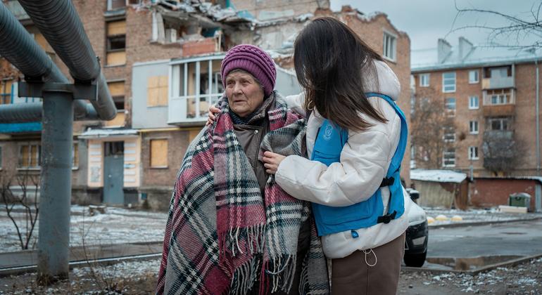 Olena stands in front of her damaged home in Kharkiv, hit during a May 2024 attack (file)