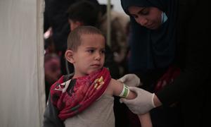 A three-year-old is screened for malnutrition at pediatrician clinic set up in a tent in Rafah, southern Gaza.