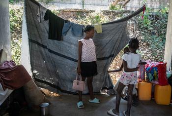 A family displaced by violence lives in a partially constructed school in Port-au-Prince, Haiti.