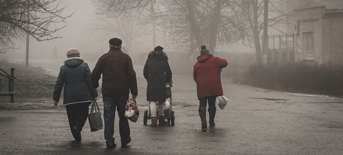People living in areas recently liberated by Ukrainian forces receive aid.