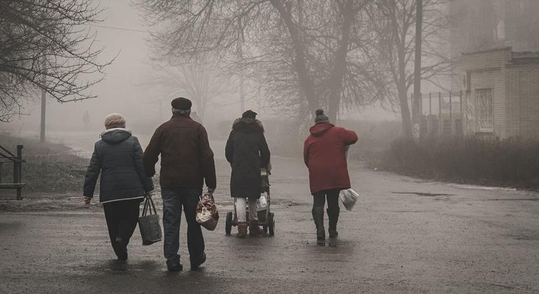 People living in areas recently liberated by Ukrainian forces receive aid.