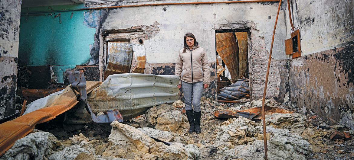 A woman stands in a bombed-out building in Pokrovsk Town in the Donetsk region of Ukraine.