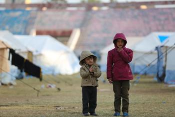 Children stand at a reception centre for newly arrived displaced families in Raqqa city, Syria.