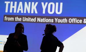 Technicians work at a youth event at the Summit of the Future.