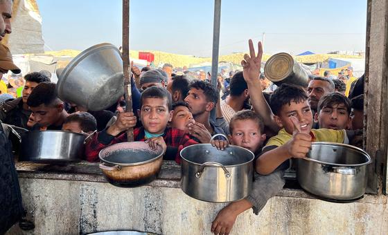 Hot meals are distributed to children in Khan Younis, Gaza.