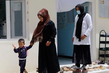 A midwife supports a mother and child at a health centre in the remote Bamyan Province, Afghanistan.