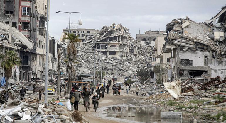 People return to devastated neighbourhoods in northern Gaza. About 90 per cent of the enclave's housing units are in ruins.