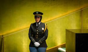 A member of the UN's security team stands on duty by the stairs leading up to the General Assembly podium.