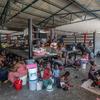 Displaced people shelter in a boxing arena in downtown Port-au-Prince after fleeing their homes during gang attacks in August 2023.