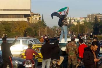 The Syrian people gather to celebrate at Damascus' Umayyad Square.