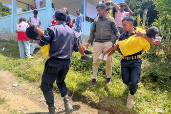 Residents of Orlalan Village, Timor-Leste simulate a landslide rescue operation 