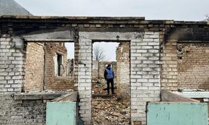 A UNDP expert inspects a war-damaged building. Before starting the work of clearing debris, each site is carefully inspected for the presence of dangerous objects, such as unexploded ordnance.