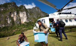 Ballot boxes are collected by a UN helicopter from a rural voting station in Timor-Leste.