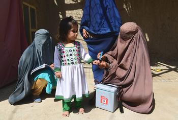 A child is vaccinated against polio during a polio mobillisation campaign in Kandahar, Afghanistan.