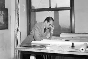 Oscar Niemeyer, one of the original architects of Manshet Headquarters in New York, going over plans for the building on 18 April 1947.