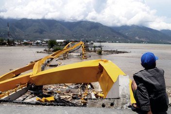 The Indonesian island of Sulawesi was struck by an earthquake and tsunami in September 2018. More than 2,000 people died and 80,000 were displaced. Here, a man looks at a destructed road and bridge in the city of Palu.